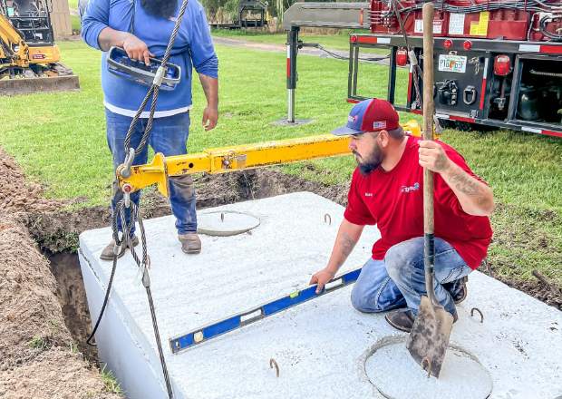 Crew installing a new septic system
